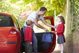 Parents dropping kid to school